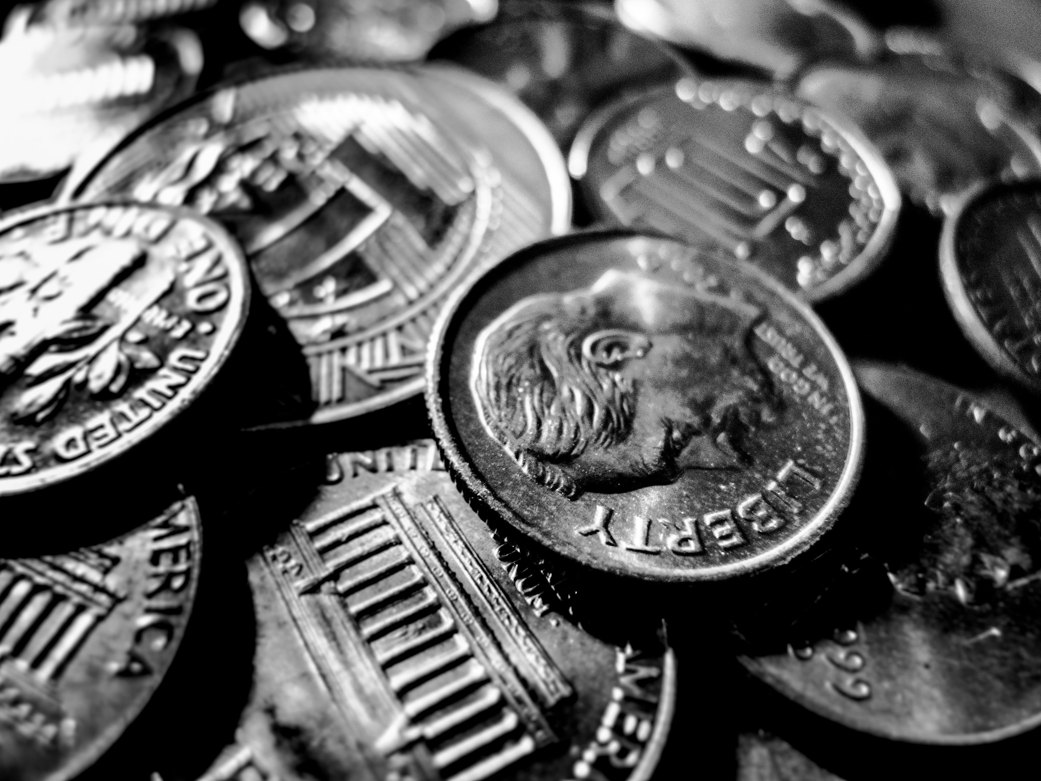 macro photo of round silver-colored coins